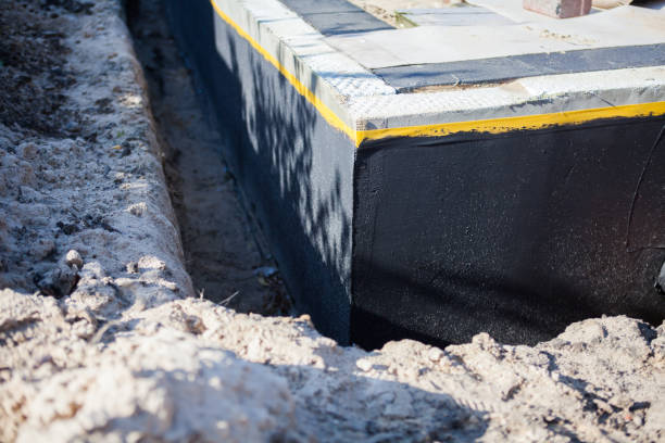 Professional Waterproofing technician working in Huron, OH